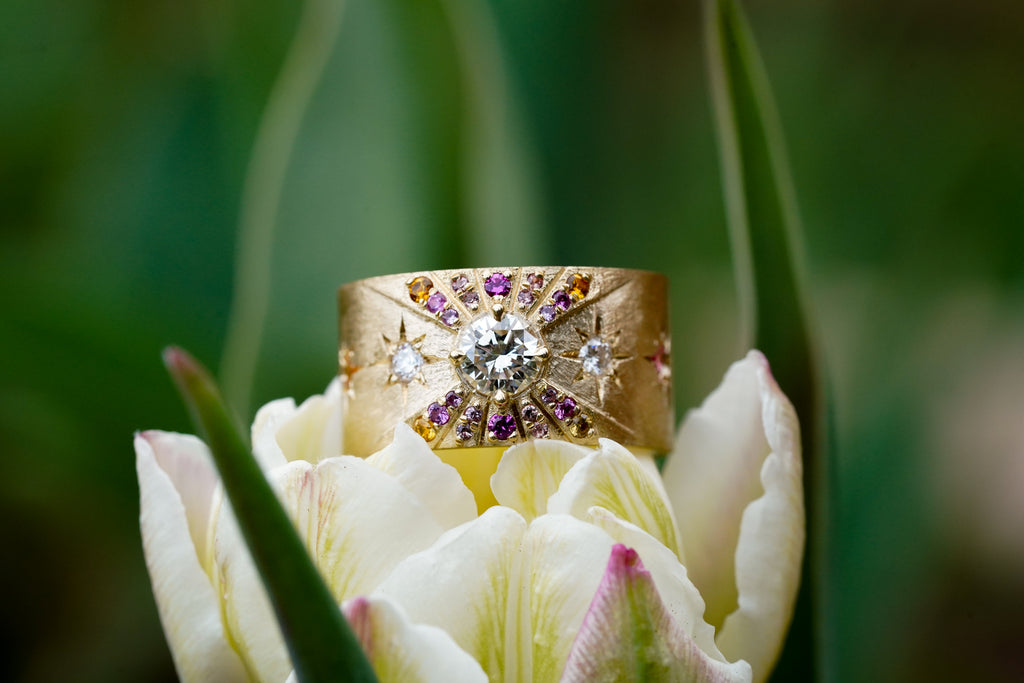 Ombré sapphire sunburst ring in matte gold with diamonds