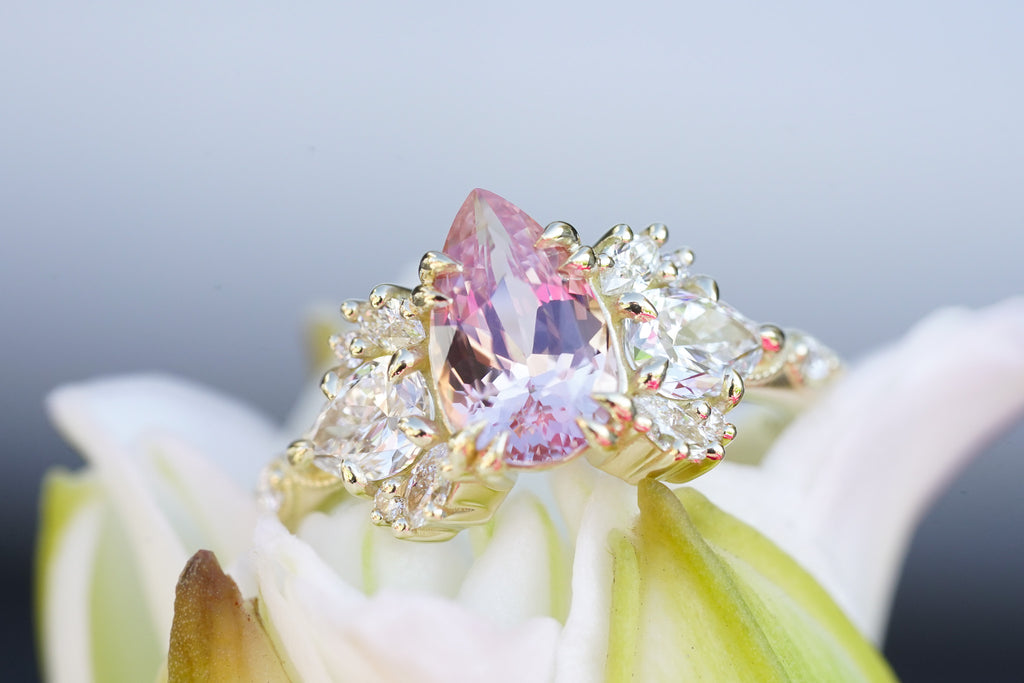 nature-inspired engagement ring with pear sapphire and marquise diamonds