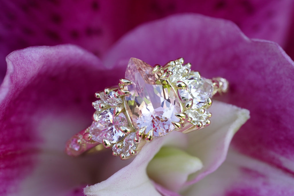 nature-inspired engagement ring with pear sapphire and marquise diamonds