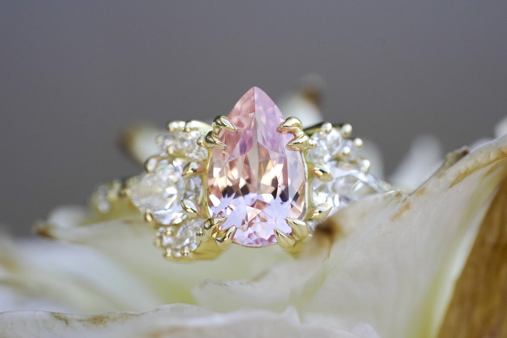 nature-inspired engagement ring with pear sapphire and marquise diamonds