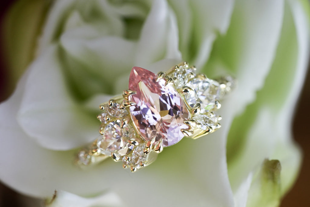 nature-inspired engagement ring with pear sapphire and marquise diamonds