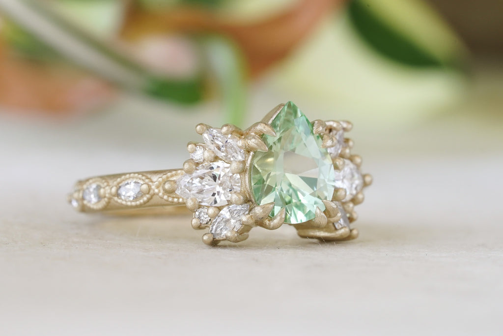 Wrapping milgrain vines in 14k gold with green garnet and lab diamonds nature-inspired