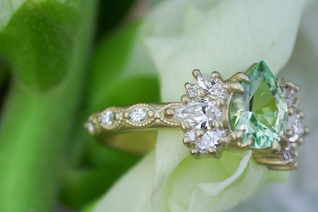 Engagement ring setting for lab-grown or natural pear diamonds