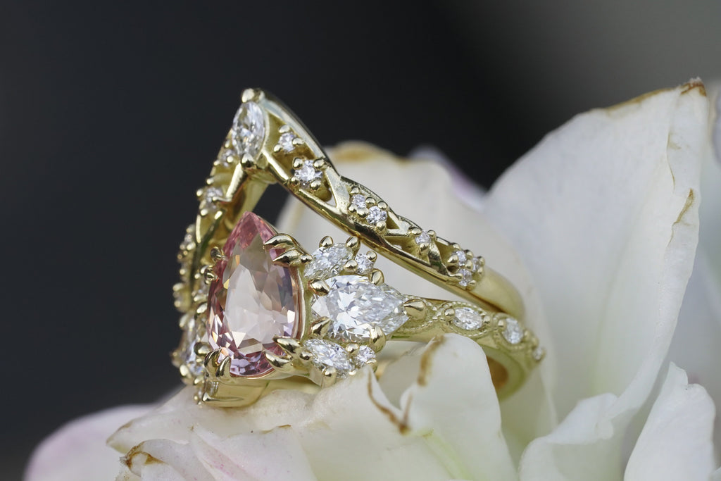 Side view of nature inspired botanical diamond twisting vine wedding set
