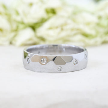 modern minimalist diamond wedding band in white gold with flush set diamonds