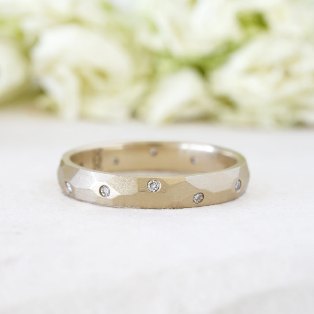 Scattered diamonds in a 3mm faceted wedding band