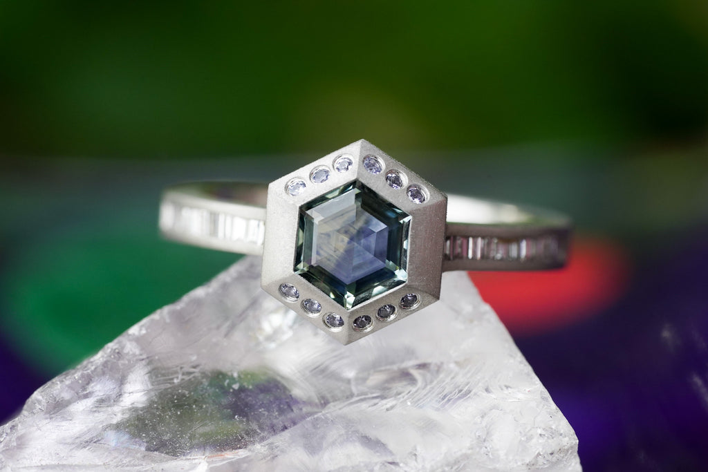 architectural solitaire ring with bezel set gemstone