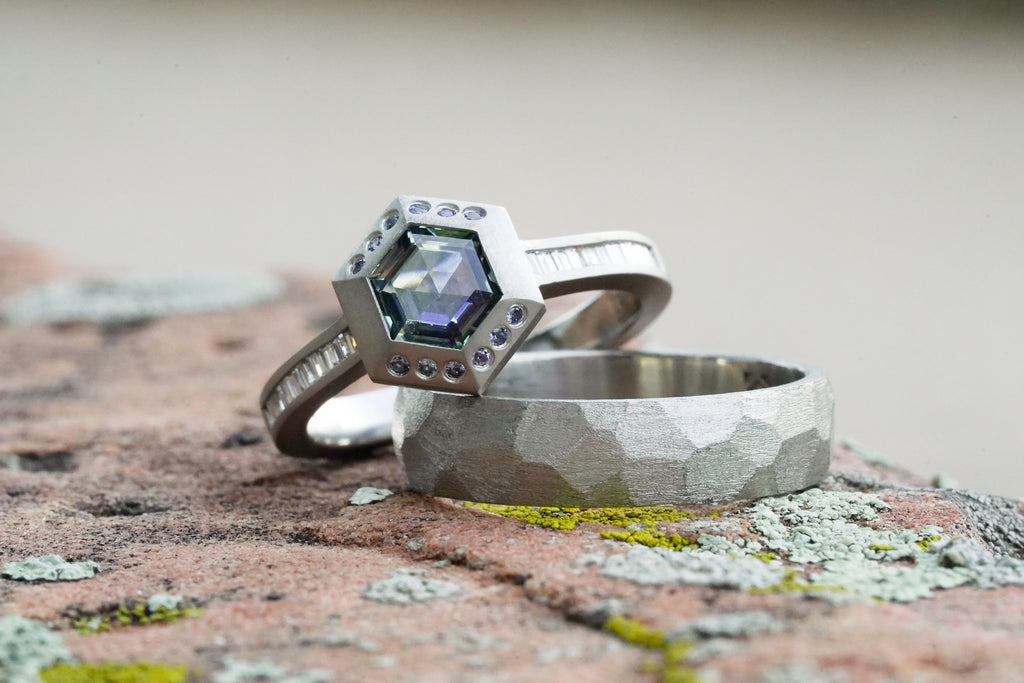 Hexagon montana sapphire in platinum with channel set diamonds and yogo sapphires