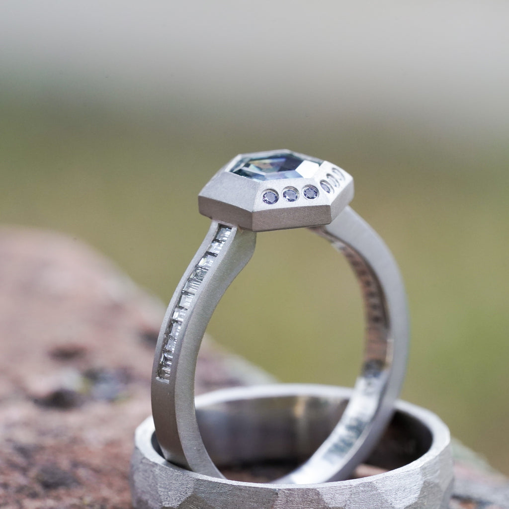 Hexagon montana sapphire in platinum with channel set diamonds and yogo sapphires