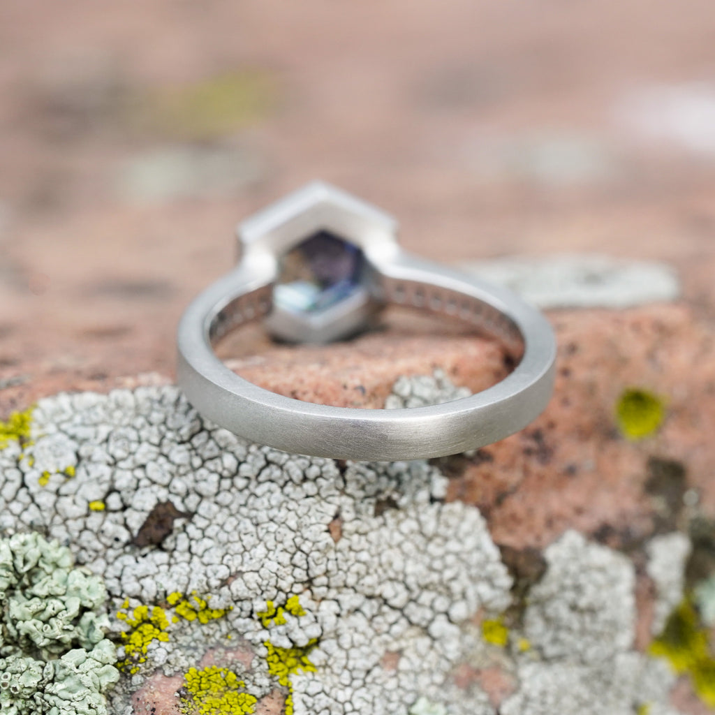 Hexagon montana sapphire in platinum with channel set diamonds and yogo sapphires