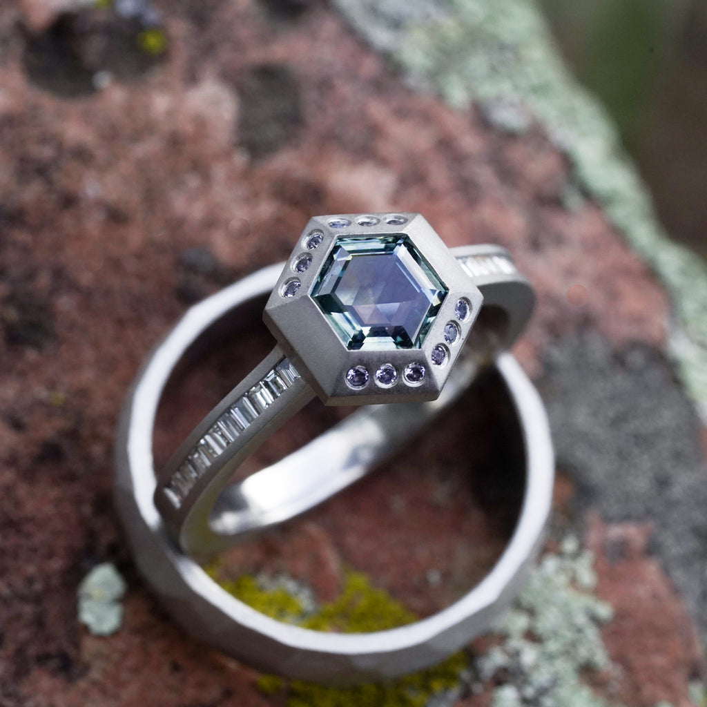 Yogo sapphire thick walled bezel surrounding a hexagon Montana Sapphire