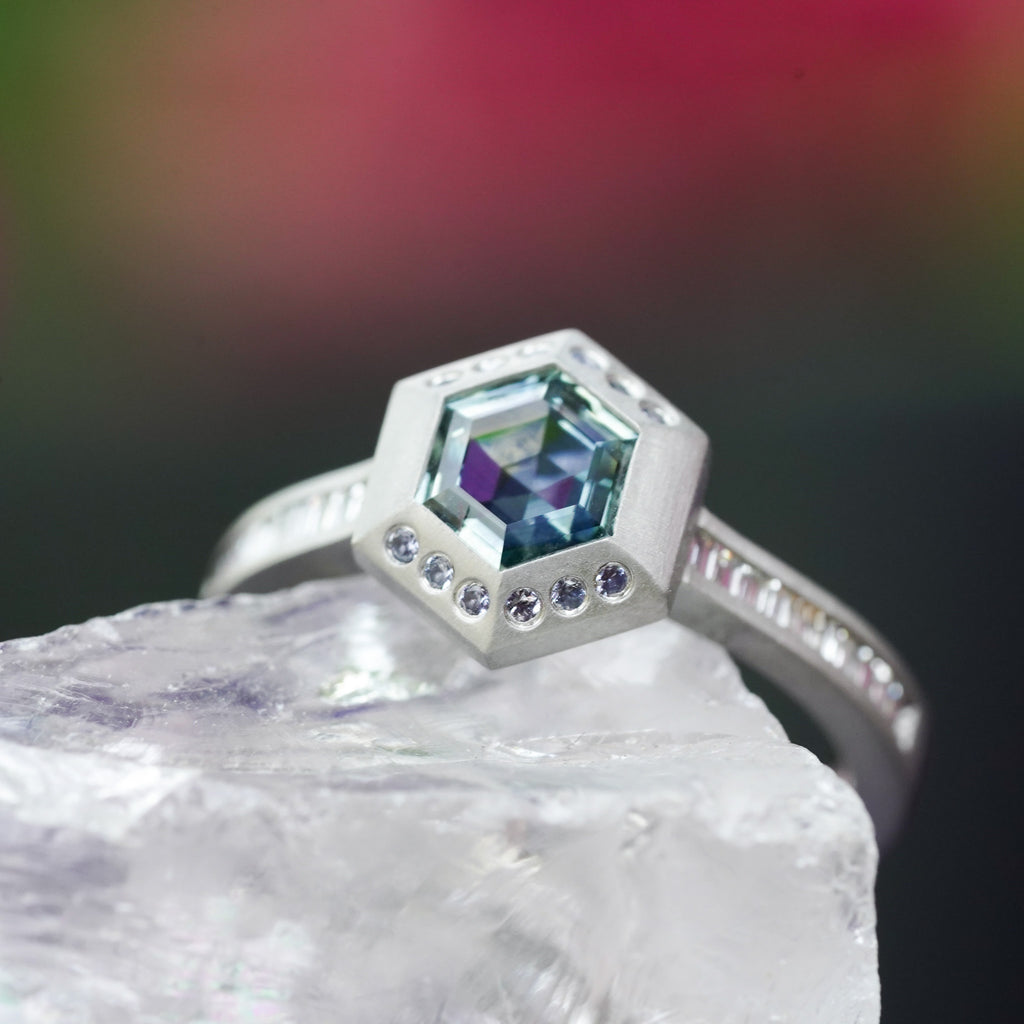 architectural solitaire ring with bezel set gemstone