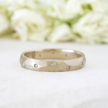custom sculptural wedding ring in 14k gold and diamonds