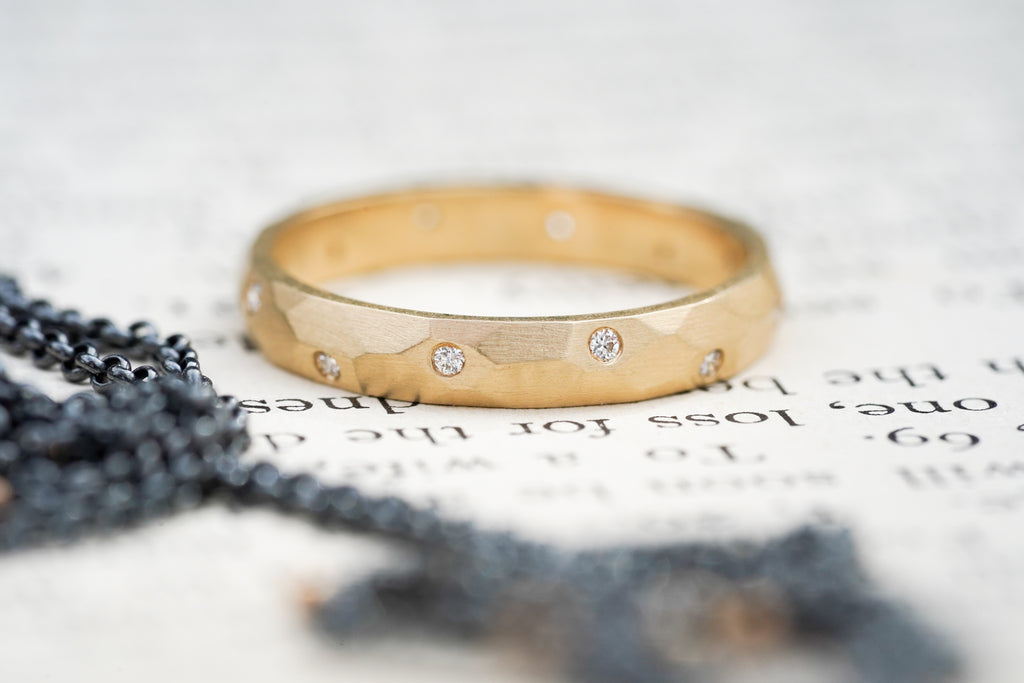 custom sculptural wedding ring in 14k gold with diamonds