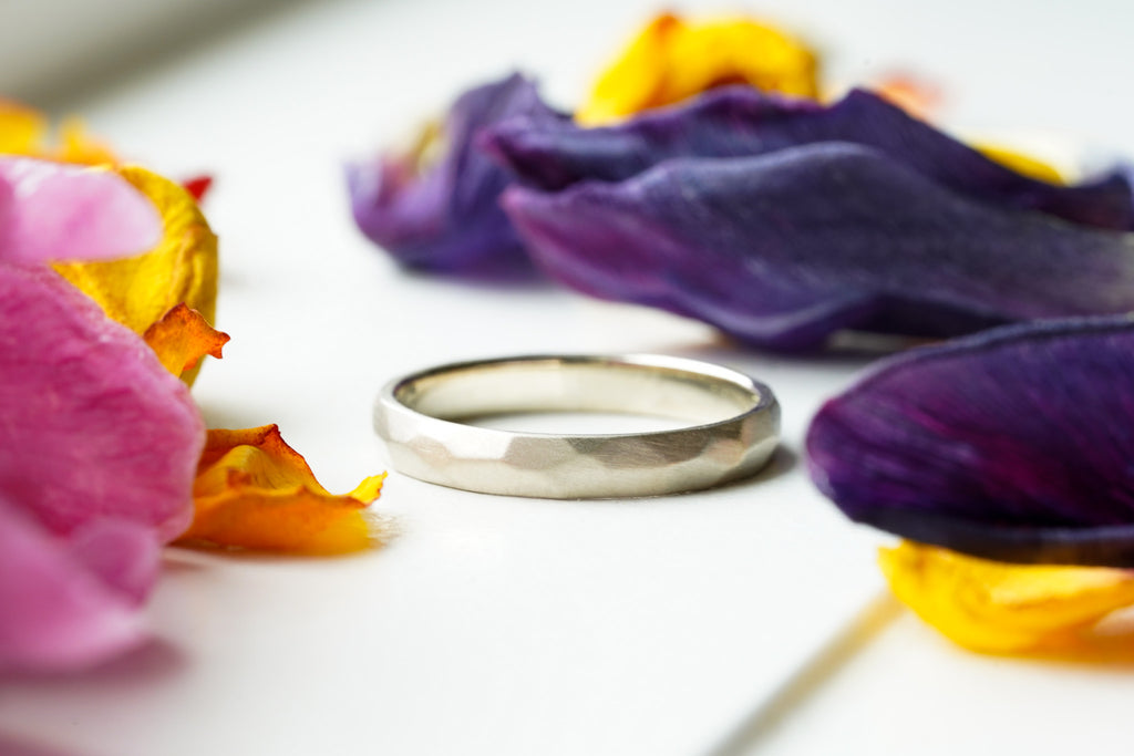 satin finish thin gold wedding band with hand-carved facets
