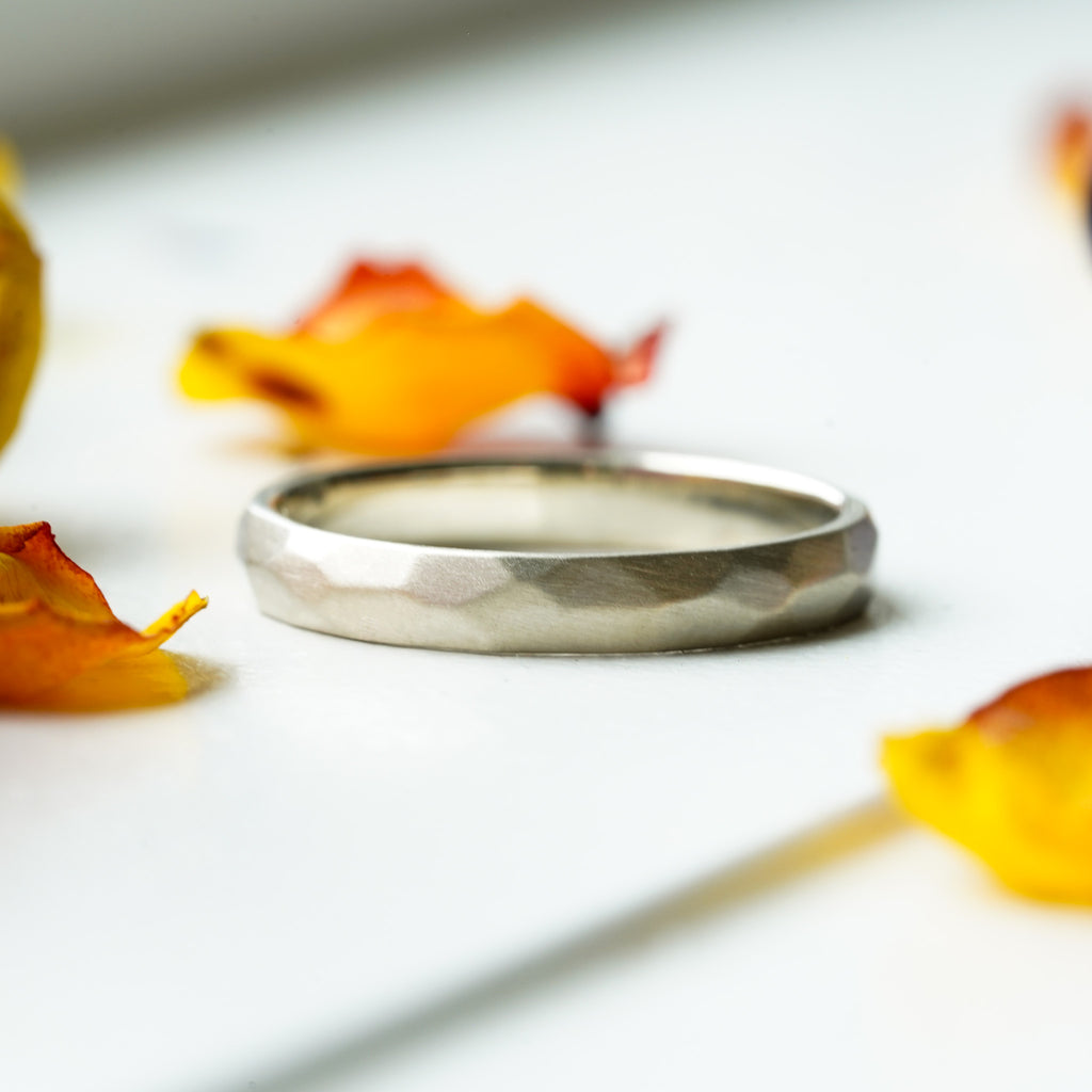satin finish thin gold wedding band with hand-carved facets