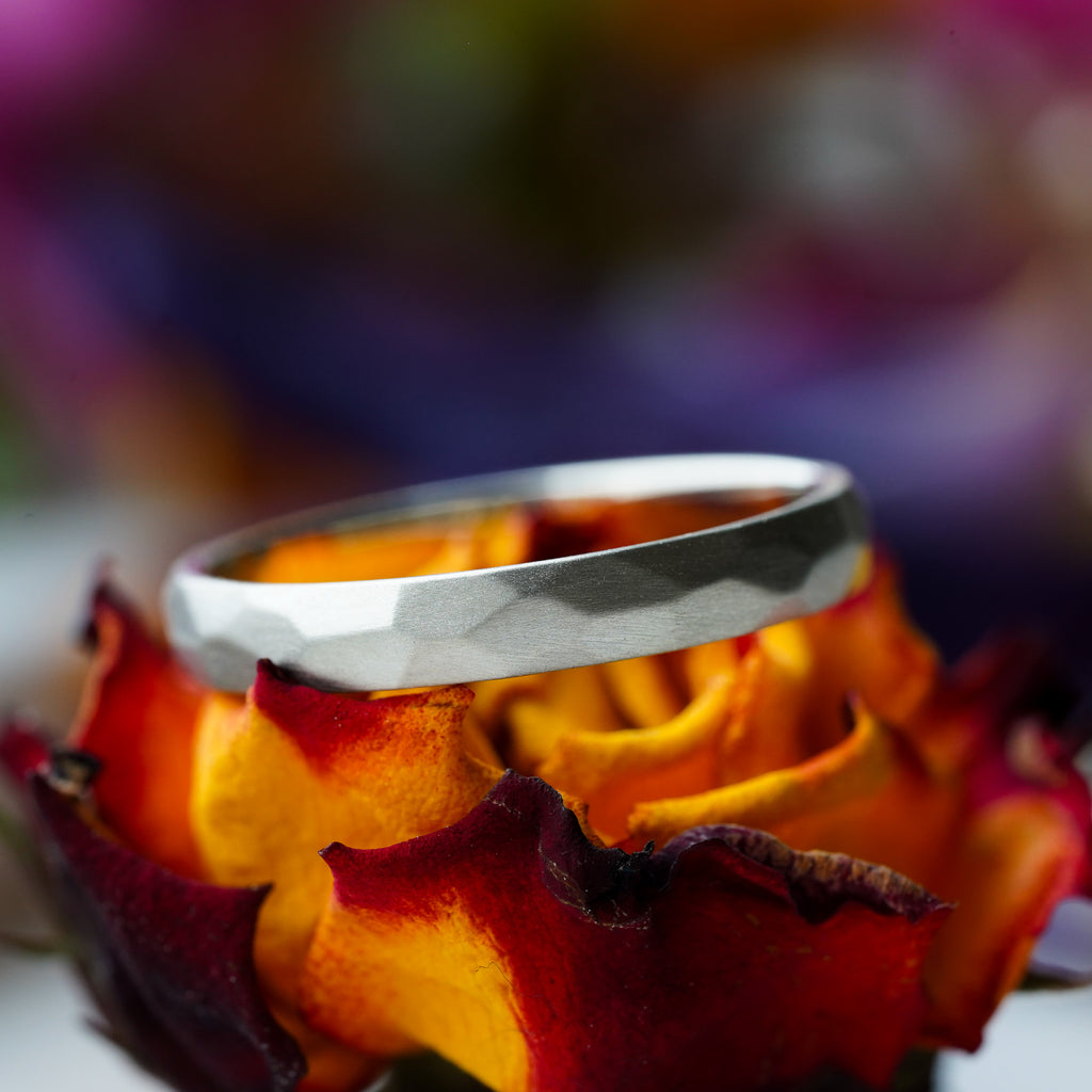 satin finish thin gold wedding band with hand-carved facets