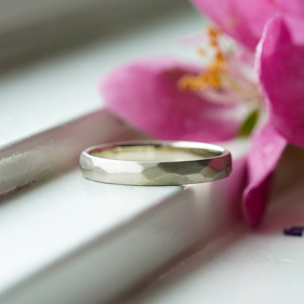 satin finish thin gold wedding band with hand-carved facets