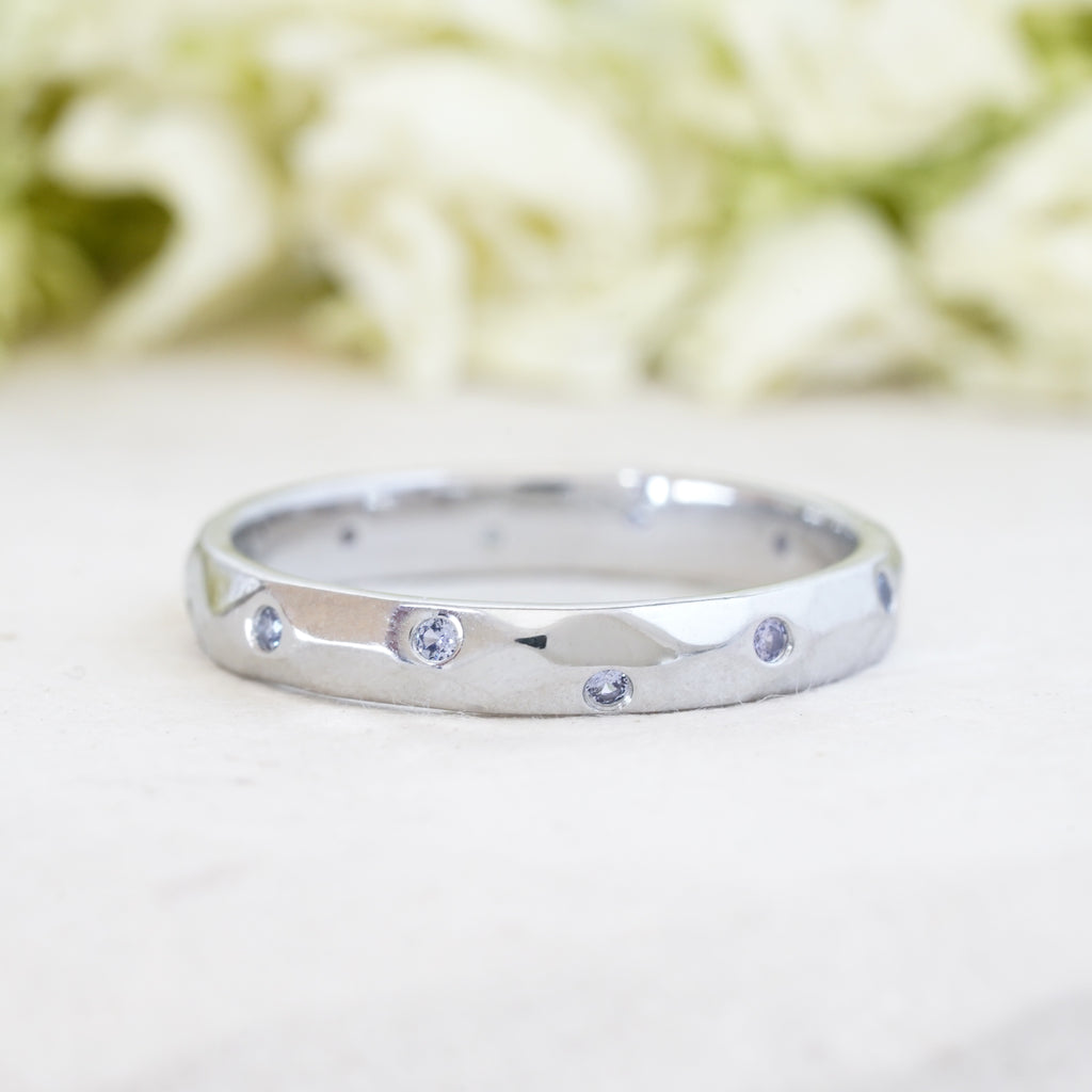 scattered sapphire flush set wedding band 