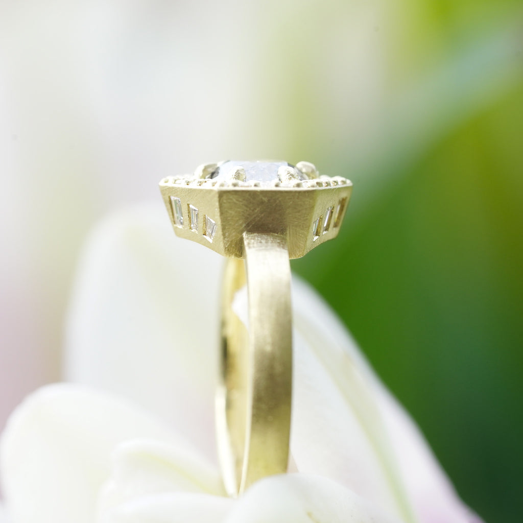 Side view of vintage engagement ring in 18k yellow gold with salt & pepper diamond