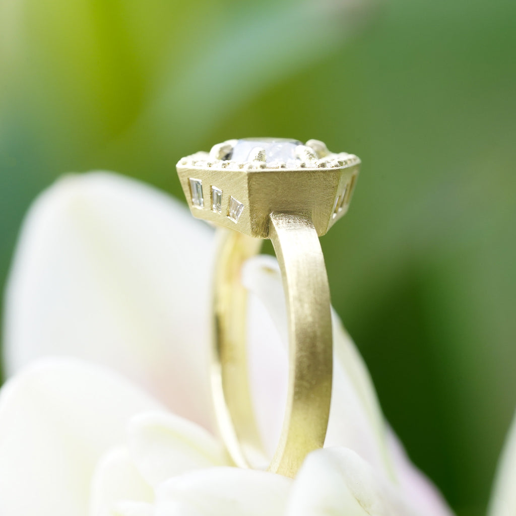 Side view of Antique style heirloom engagement ring with hidden baguette accents