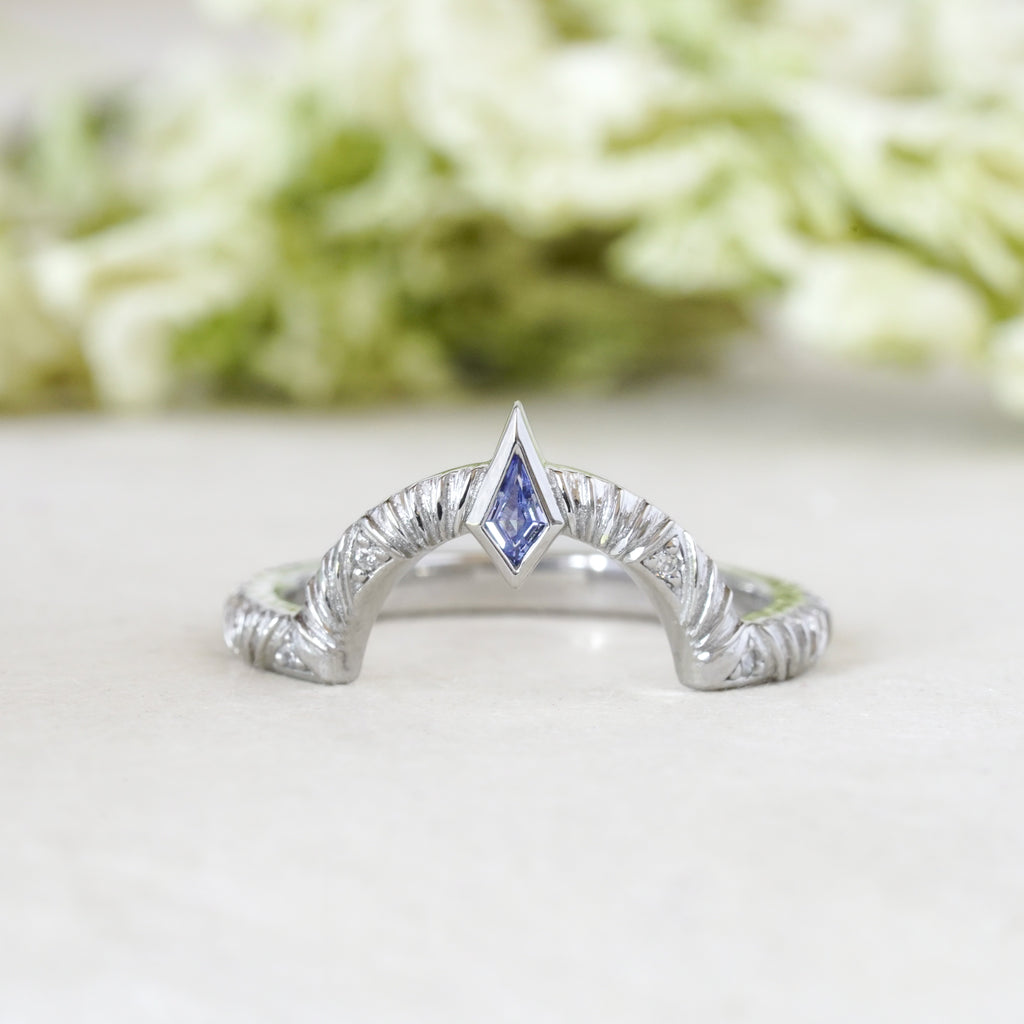 blue sapphire kite contour wedding band in art deco style with diamonds and texture