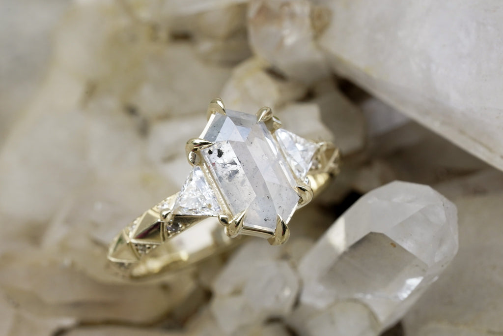 edgy low-profile engagement ring with celestial symbolism