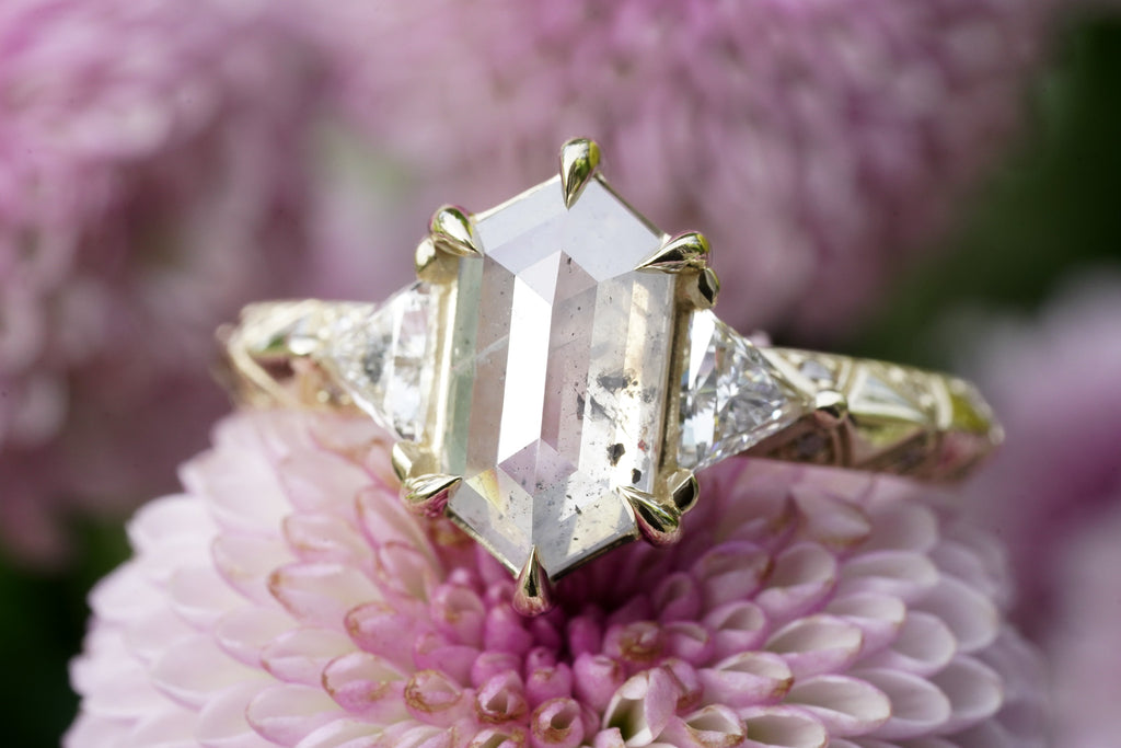 mystical engagement ring with natural salt and pepper center
