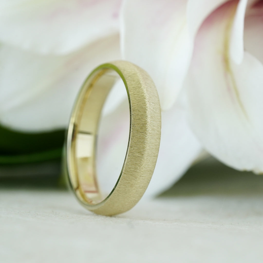 knife-edge men’s wedding band in recycled yellow gold