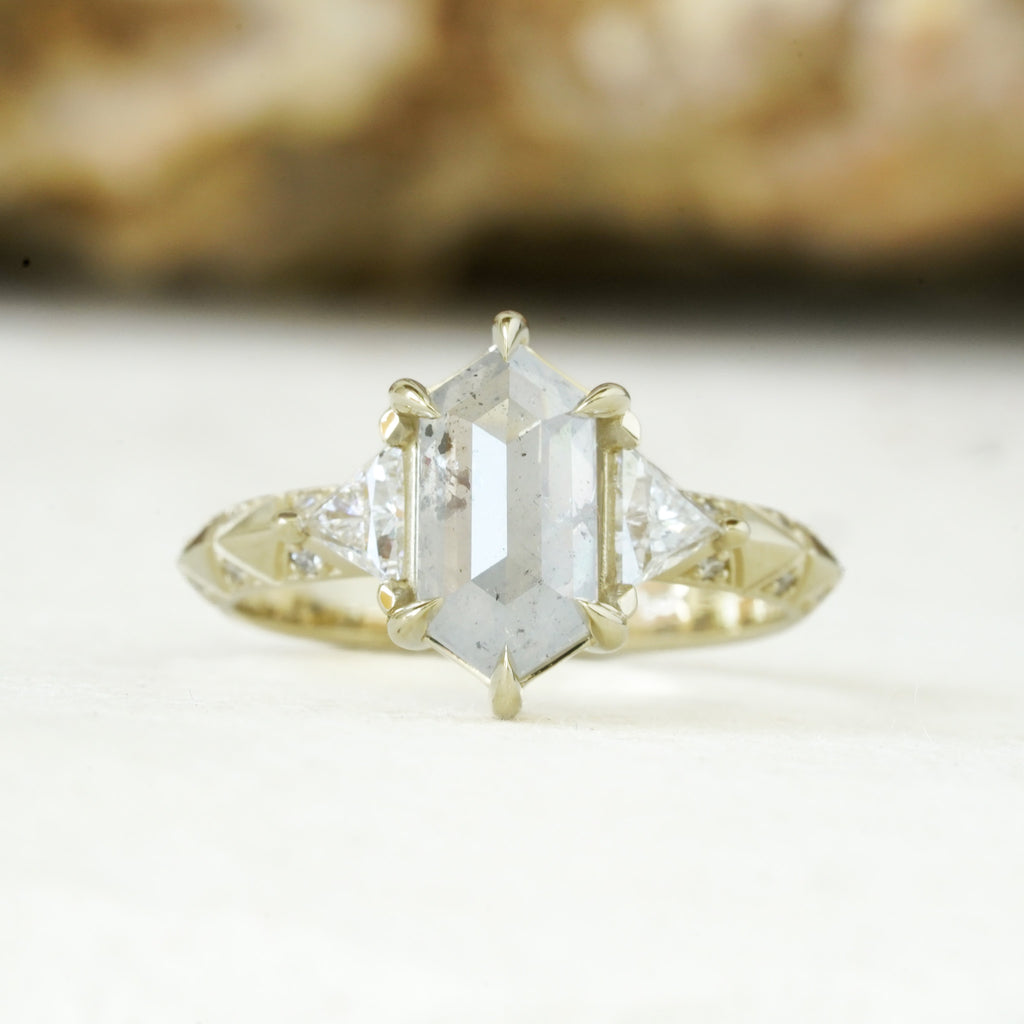 mystical engagement ring with natural salt and pepper center