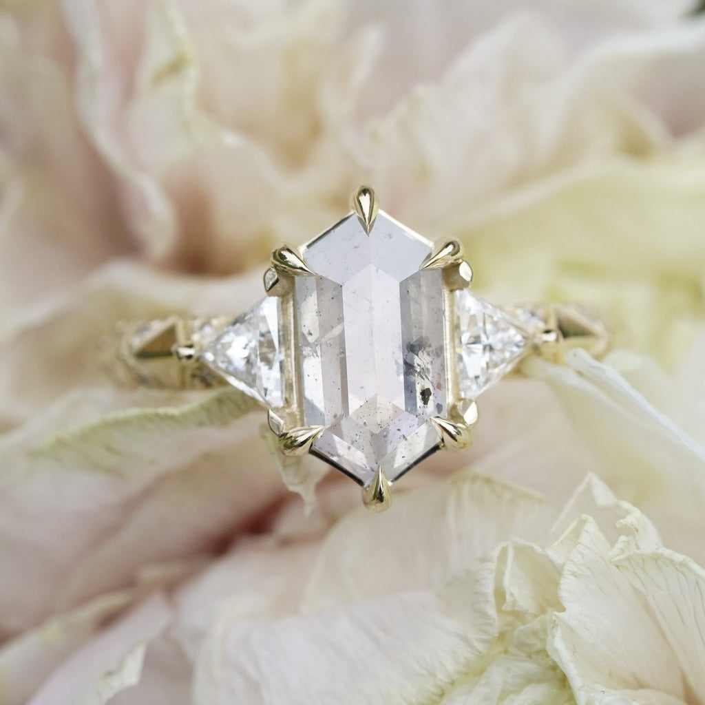 edgy low-profile engagement ring with celestial symbolism