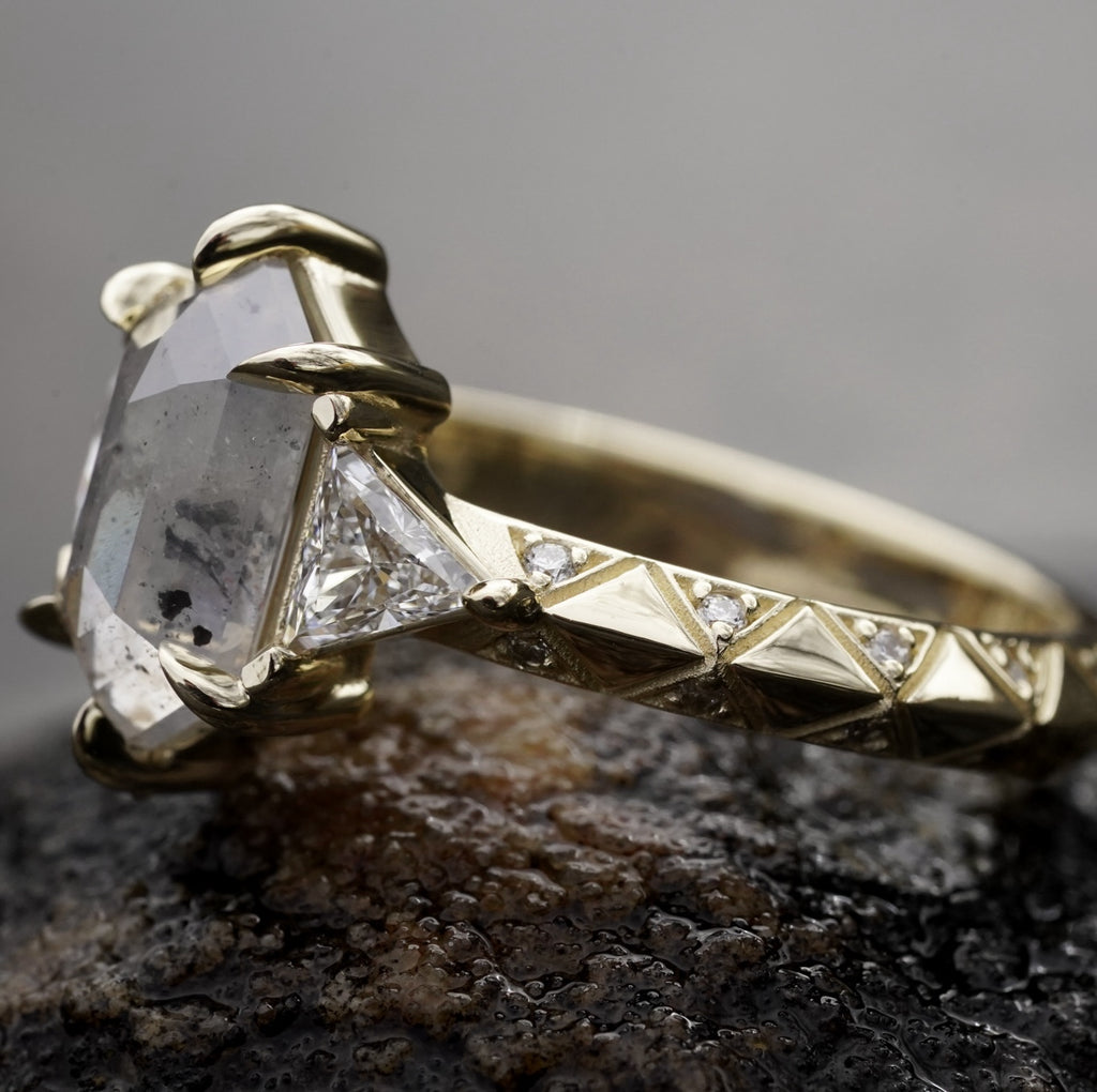 edgy low-profile engagement ring with celestial symbolism