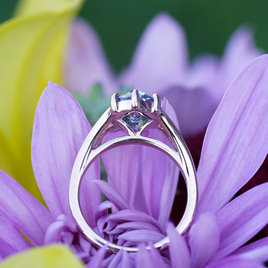 Side view of prong set high profile lab-grown diamond on recycled gold band