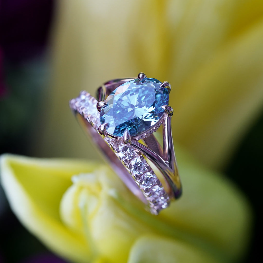 Close-up of prong set lab-grown diamond on recycled gold band