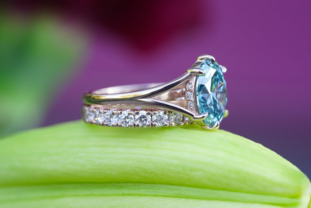 Side view of Grecian-inspired oval diamond engagement ring