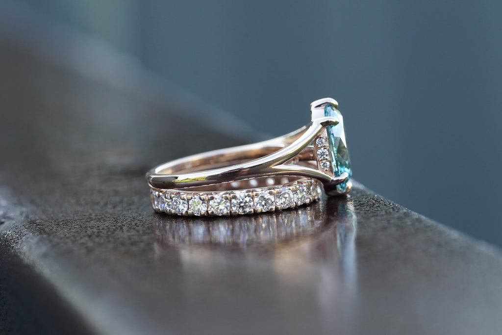 Side view of Grecian-inspired oval diamond engagement ring