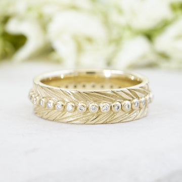 Diamond spine feather boho wedding band in 14k yellow gold 