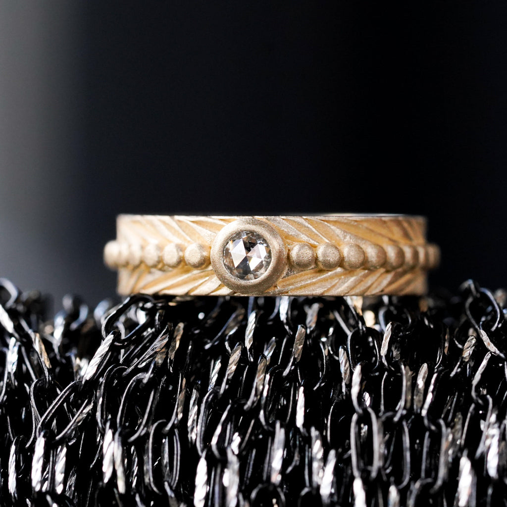 salt and pepper rosecut bezel set diamond set in a boho feather wedding band