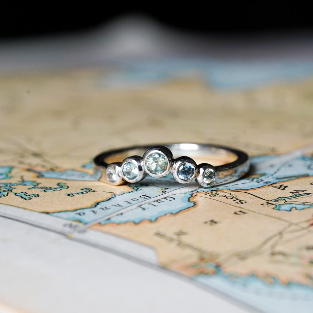 Round bezel montana sapphire contour wedding band 