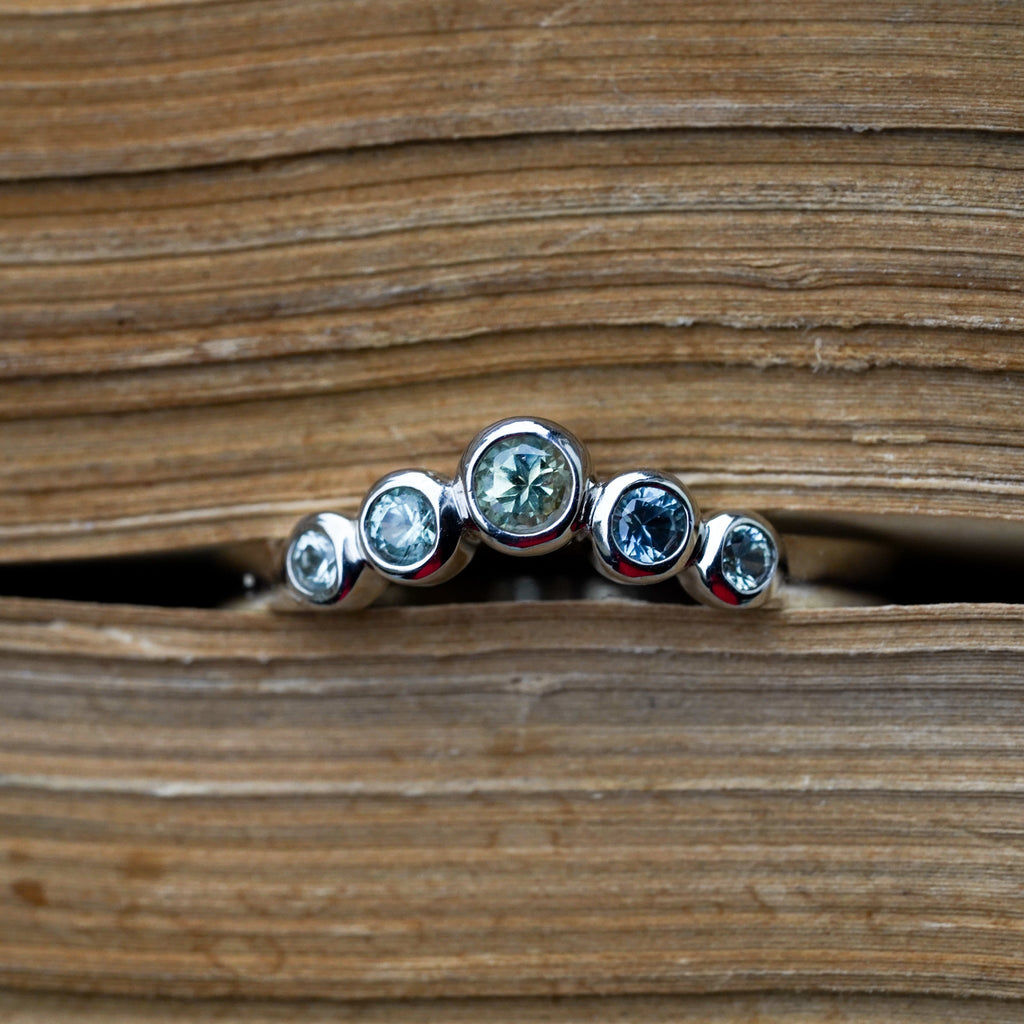 Round bezel montana sapphire contour wedding band 