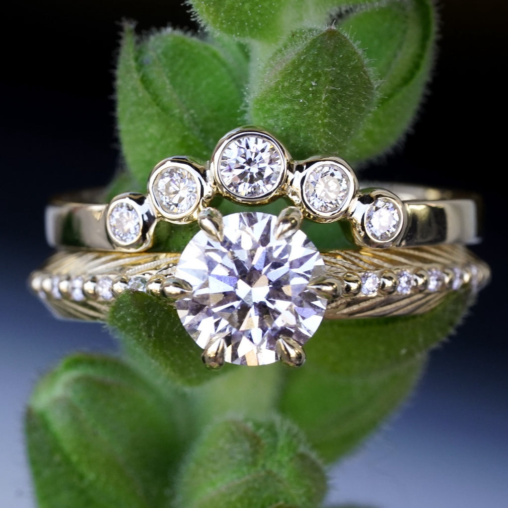 boho engagement ring with diamond and feather pattern with a round diamond contour band on top