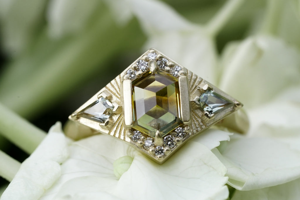 Starburst engagement ring with kite sapphires