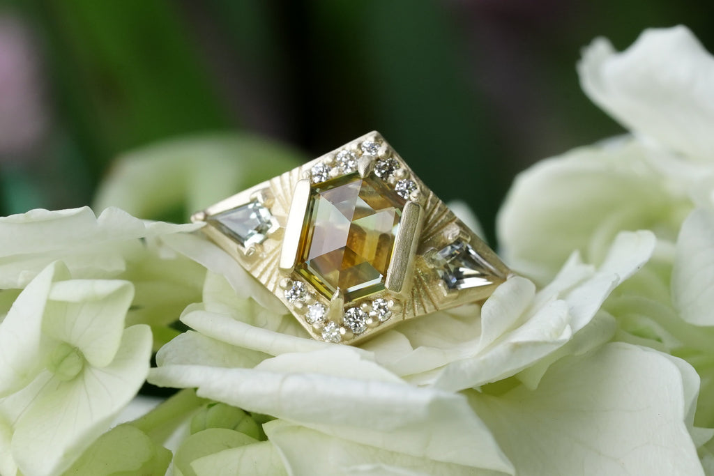Starburst engagement ring with kite sapphires