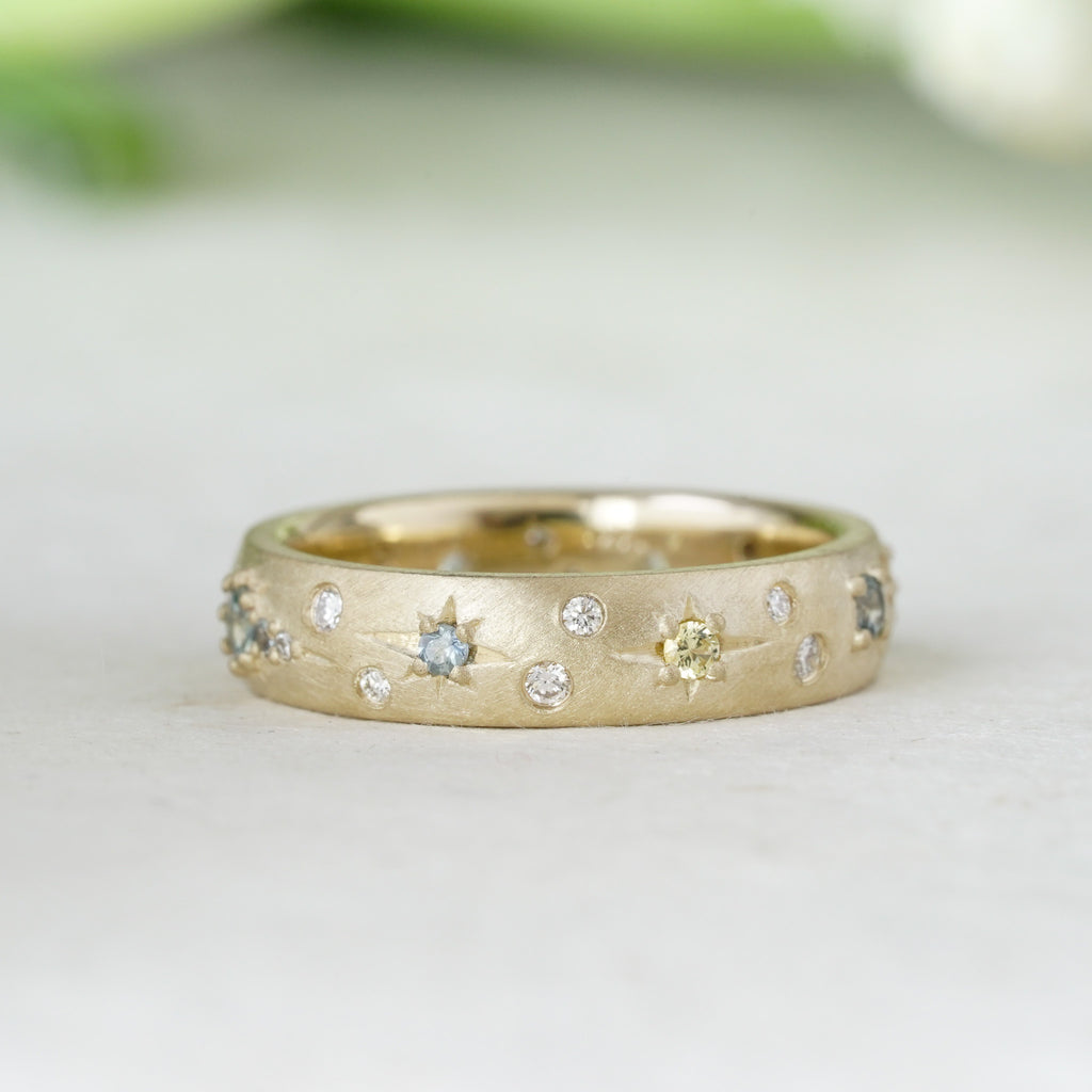 flush set celestial wedding band with diamonds and sapphires