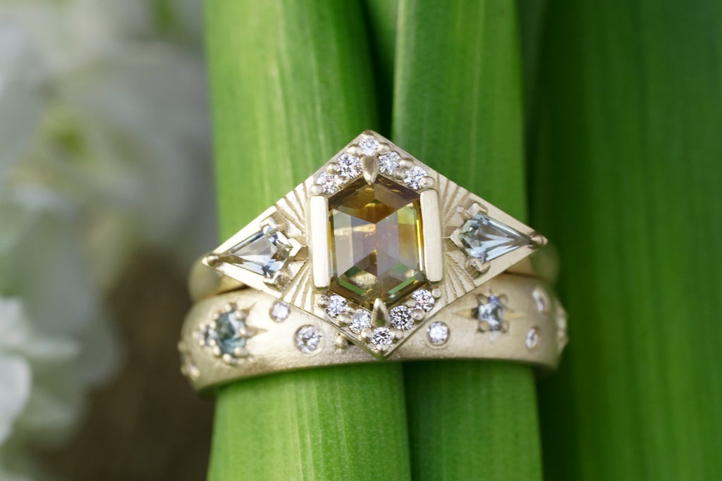 custom celestial engagement ring with zodiac symbolism