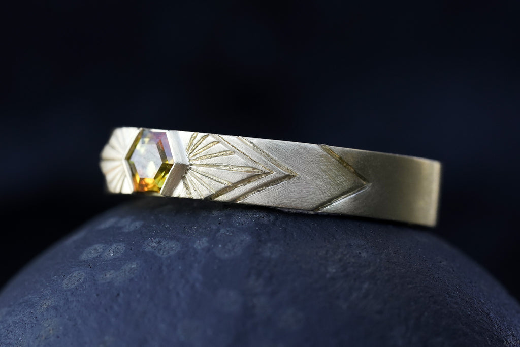 14k Yellow Gold orange montana hexagon sapphire in a radiating sunburst engraved wedding band