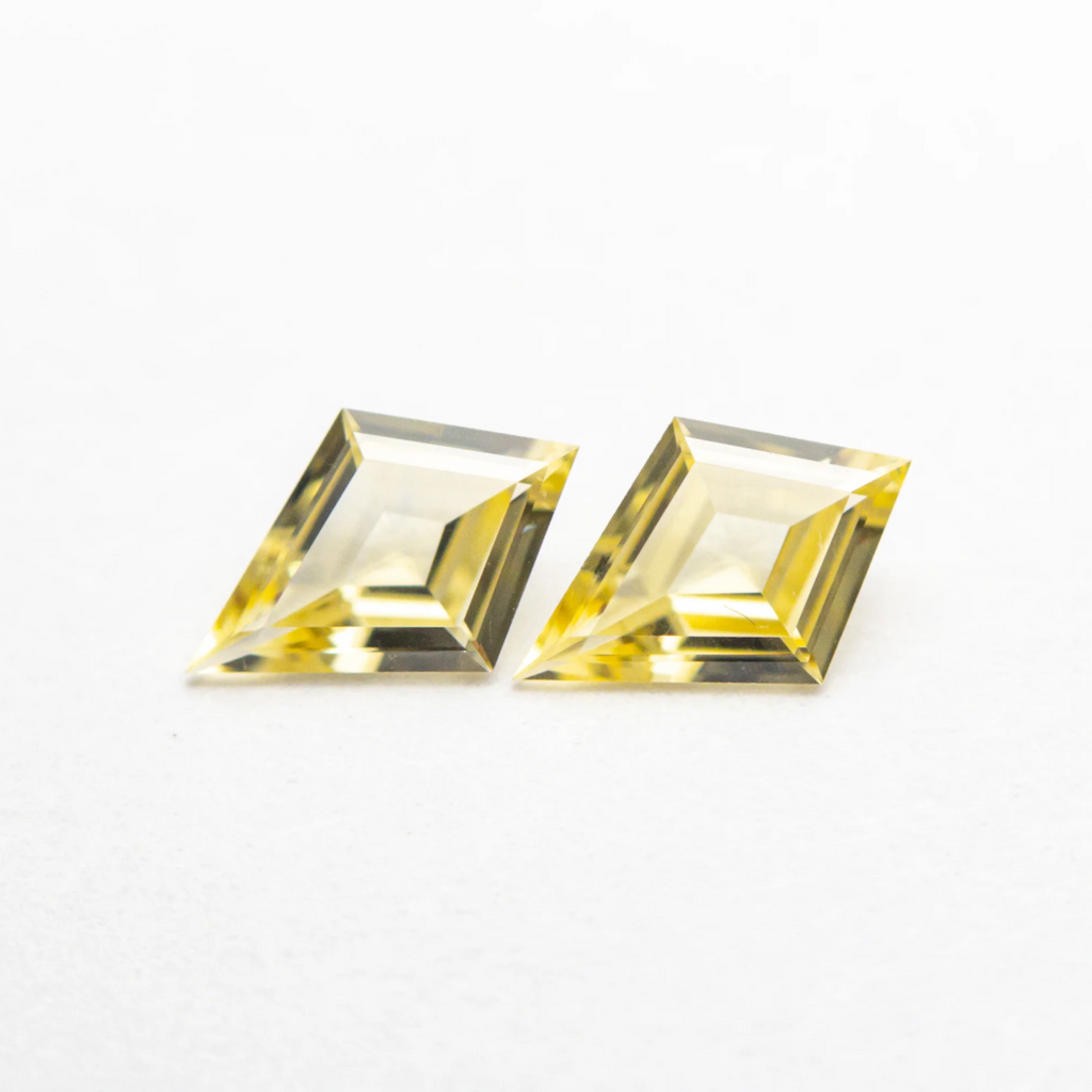 Match pair of yellow sapphire kites