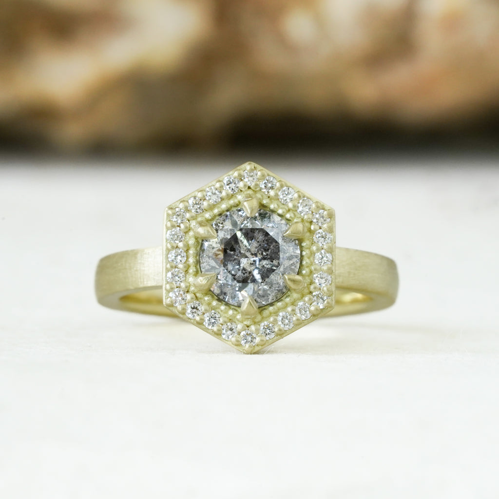 18k matte yellow gold with a salt and pepper diamond in a hexagon halo diamonds setting